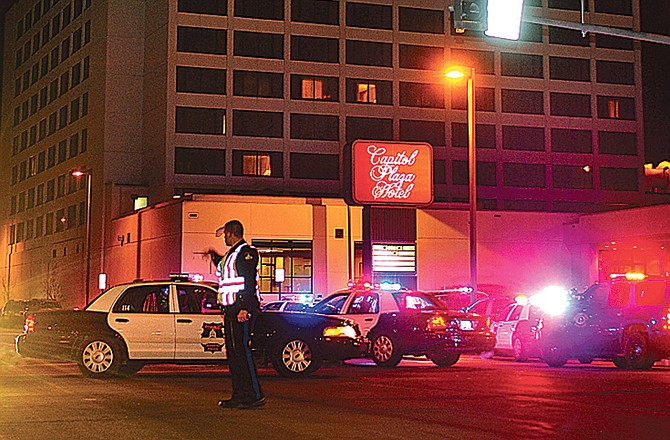 Jefferson City police, Missouri State Highway patrolmen and sheriff's deputies surround the Capitol Plaza Hotel in Jefferson City on Dec. 10, 2011, shortly after a shooting incident. (News Tribune photo)