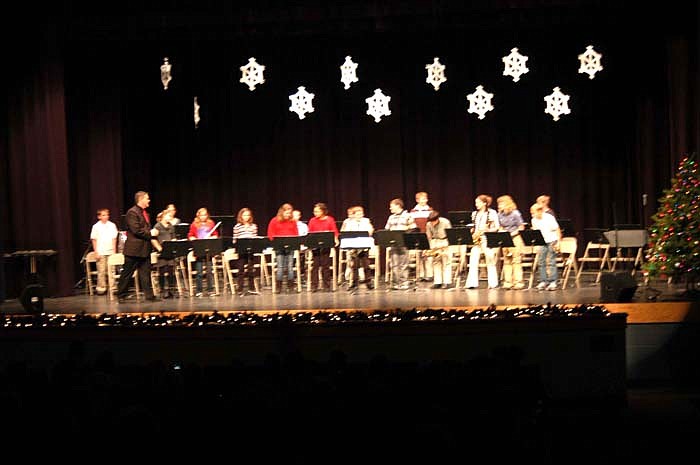 The CMS Sixth Grade Band finishes its performance at the Christmas Concert.