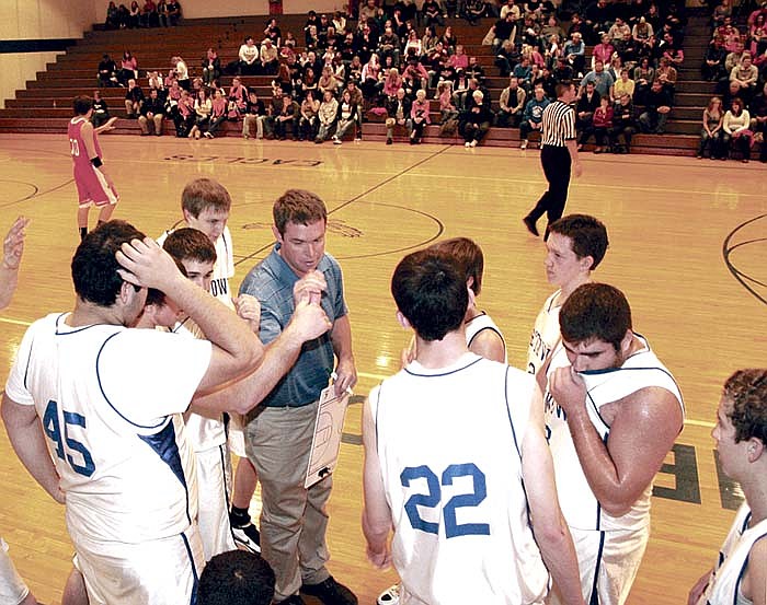 Jamestown Coach Ronnie Conner, center, talks to the varsity Eagles during a time-out Saturday at the Jamestown Tournament.