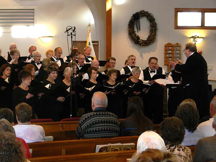 The Greater Lake Area Chorale sings "The Star (A Christmas Scene)" during their program of "It Came Upon a Midnight Clear" presented at St. Michael's Catholic Church, Russellville, Sunday, Dec. 11.