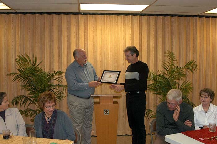 CPI President Brian Scrivner presents a Certificate of Appreciation to Jeff Shackleford for his 12 years on the board of directors. He is a past president of the organization and was most recently secretary.