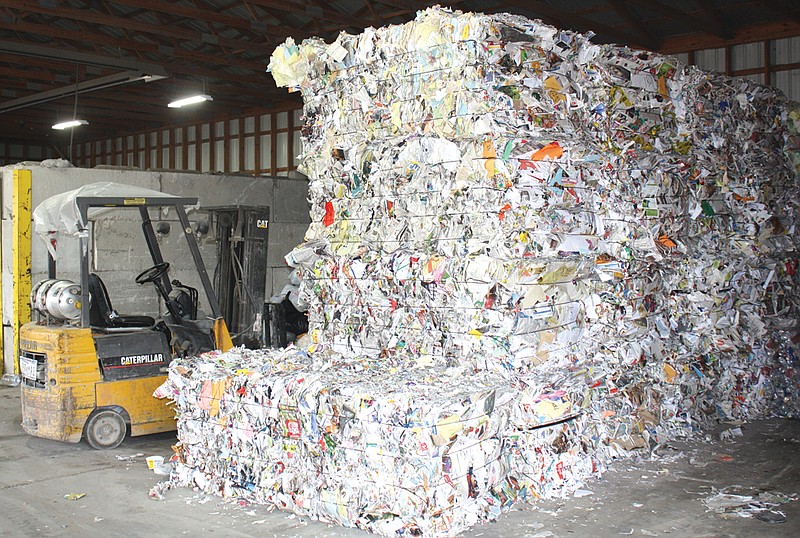 Baled paper products sit in a warehouse of Kingdom Projects, Inc. ready to be sold and shipped out. KPI collects recyclable materials from area residents at its facility in Fulton.