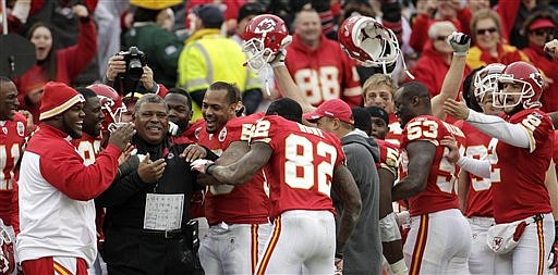 Kansas City Chiefs coach Romeo Crennel celebrates with his team during the second half of an NFL football game against the Green Bay Packers on Sunday, Dec. 18, 2011, in Kansas City, Mo. The Chiefs won 19-14.