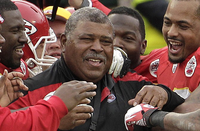 Chiefs interim coach Romeo Crennel is all smiles after Sunday's 19-14 win over the Packers at Arrowhead Stadium.