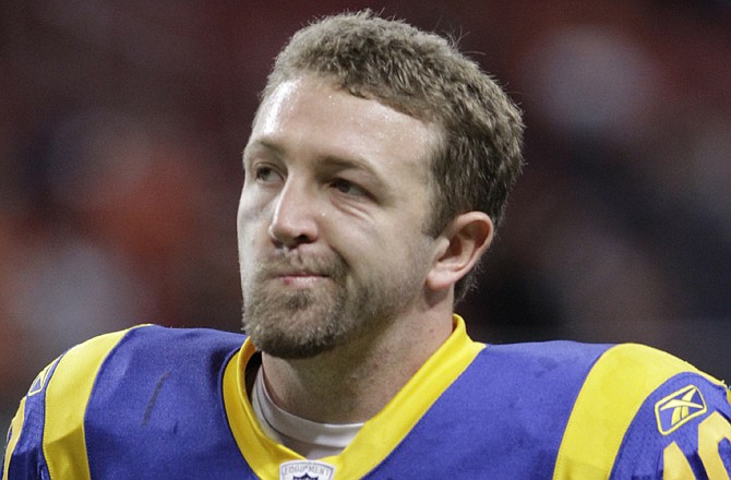 Rams quarterback Kellen Clemens jogs off the field following Sunday's 20-13 loss to the Bengals at the Edward Jones Dome.