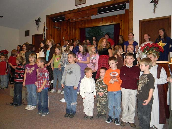 The children concluded the Christmas program, "The Littlest Star," held at Pilot Grove Baptist Church, Latham, Wednesday, Dec. 14, by singing "Silent Night" with those in attendance.