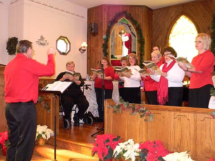Music Director Kurt Brewer directs members from Russellville United Methodist Church as they sing "Christmas is Coming" during the performance of their Christmas cantata "Celebrate the Season" Sunday, Dec. 18.