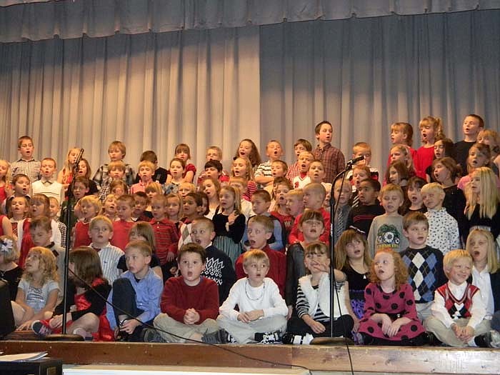 A group of kindergarten through second graders sing "Silent Night" with the audience to close the first program. The concerts were split into two performances, one by the H.U.G.S. Singers through second grade, and the second by third through fifth graders.