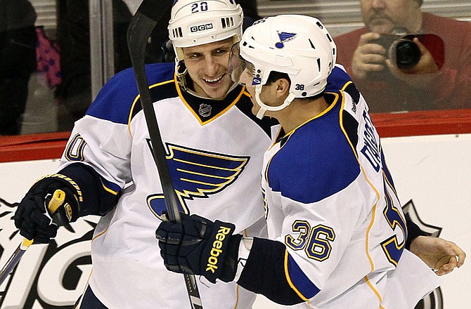 St. Louis Blues' Alexander Steen, left, celebrates his goal with Matt D'Agostini (36) against the Phoenix Coyotes during the second period of an NHL hockey game, Friday, Dec. 23, 2011, in Glendale, Ariz. 