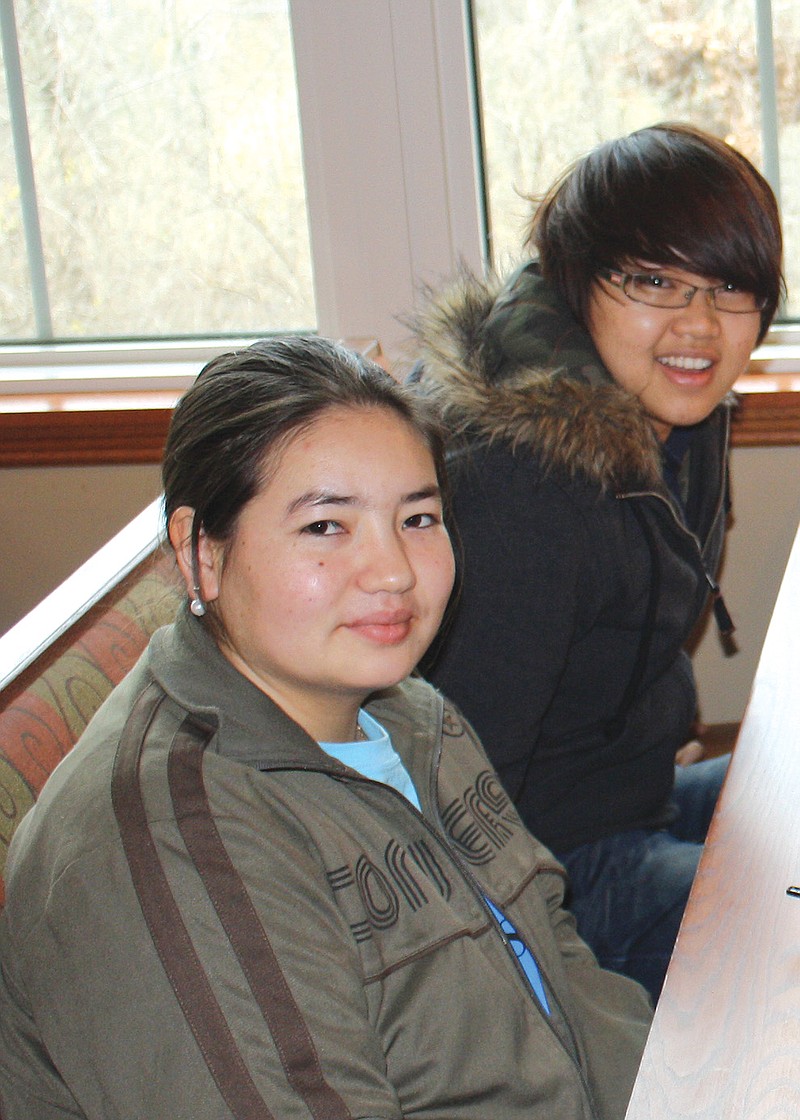 On Monday, Westminster College international students Amannisa Sawuti (front) and Jen Nguyen talk about their time spent Christmas Day at Catherine Pesce's house. 