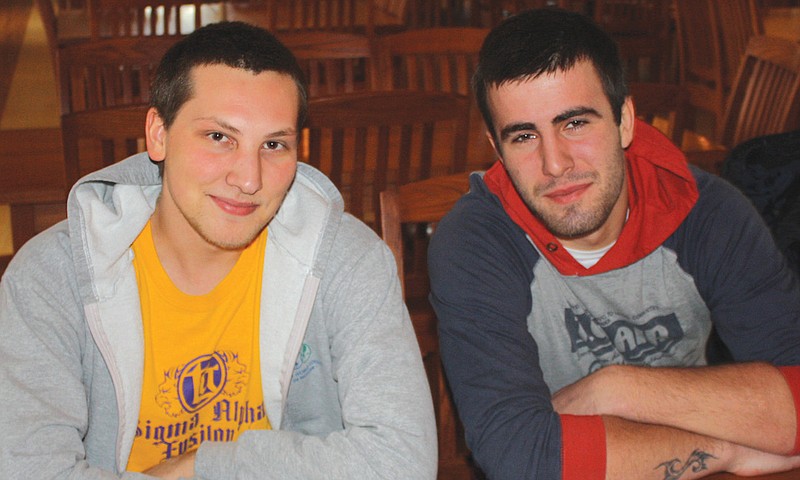 Westminster College sophomores Miran Milavic (left) and Azer Donko, both from Bosnia-Herzegovina, eat lunch together Monday in the college canteen. The students say they keep busy over Christmas break by working on campus.