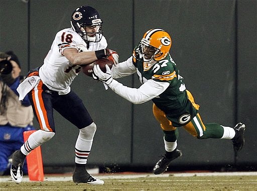 Green Bay Packers' Sam Shields (37) breaks up a pass intended for Chicago Bears' Dane Sanzenbacher (18) during the second half of an NFL football game Sunday, Dec. 25, 2011, in Green Bay, Wis.