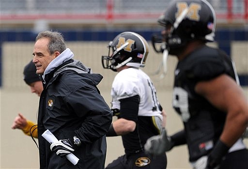 Missouri head coach Gary Pinkel leads his players on Thursday, Dec. 22, 2011, during practice in Shreveport, La., for their Independence Bowl NCAA college football game scheduled for Dec. 26 against North Carolina. (AP Photo/The Shreveport Times, Jim Hudelson)