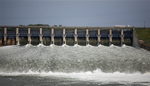 In this June 9, 2011 file photo, water runs down the spillway at the Fort Randall dam in Pickstown, S.D. (AP Photo/Argus Leader, Devin Wagner)