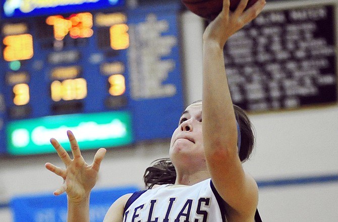 Taylor Hagenhoff of Helias goes up for two of her 17 points during Wednesday's game against Omaha Mercy in the State Farm Holiday Hoops Invitational at Rackers Fieldhouse.