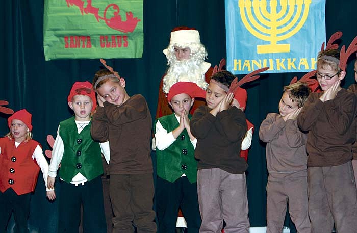 The kindergarten and first grade students perform "Rockin' Old St. Nicholas."