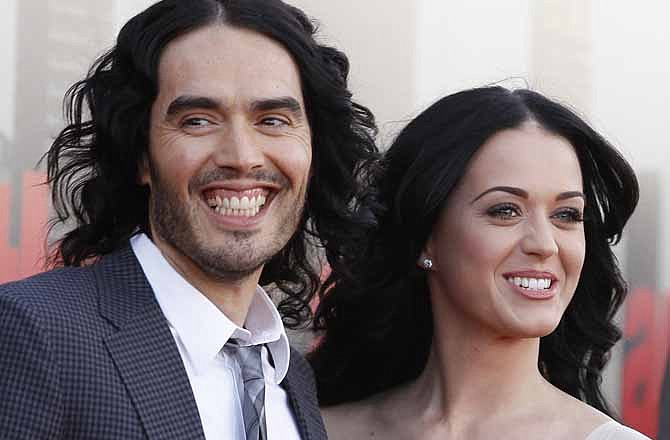 In this Tuesday, April 19, 2011 file photo, British actor Russell Brand and his wife Katy Perry arrive for the European premiere of Arthur, in London. The couple are getting a divorce, Brand told The Associated Press Friday Dec. 30, 2011. He and the 27-year-old pop singer were married in October 2010 at a resort inside a tiger reserve in India.