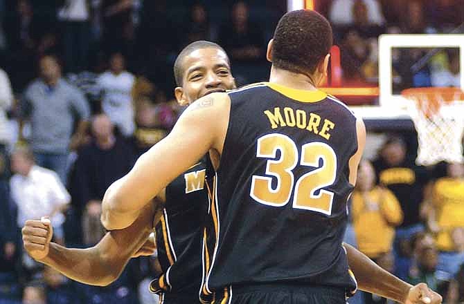 Missouri teammates Kim English and Steve Moore celebrate after the Tigers' 75-68 win Friday night over the Old Dominion Monarchs in Norfolk, Va. 