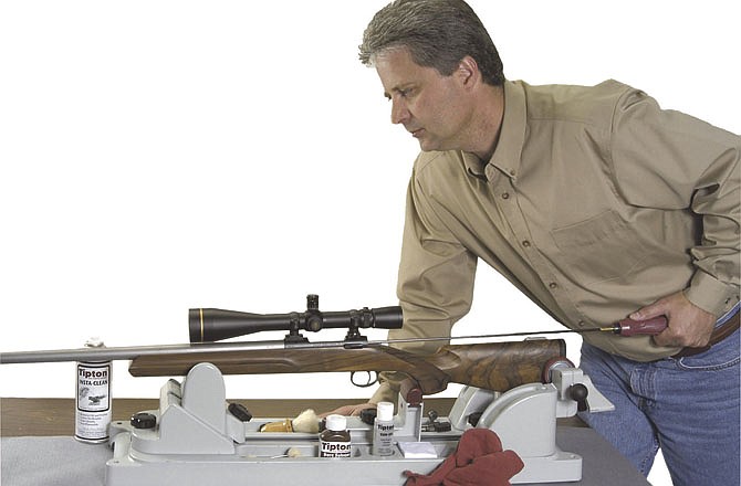 Winter is a good time to clean your guns, as shown by Dennis Cauley of Boonville, Mo.