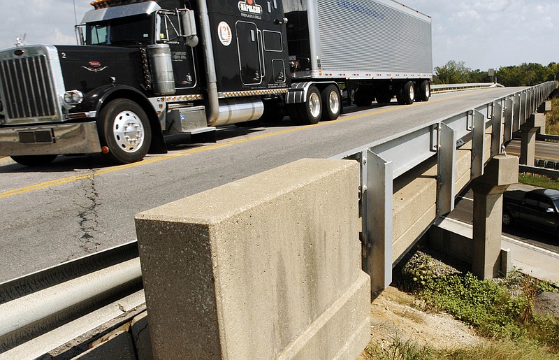 A truck drives on the U.S. 40 bridge over I-70 near Midway. (Associated Press file photo)