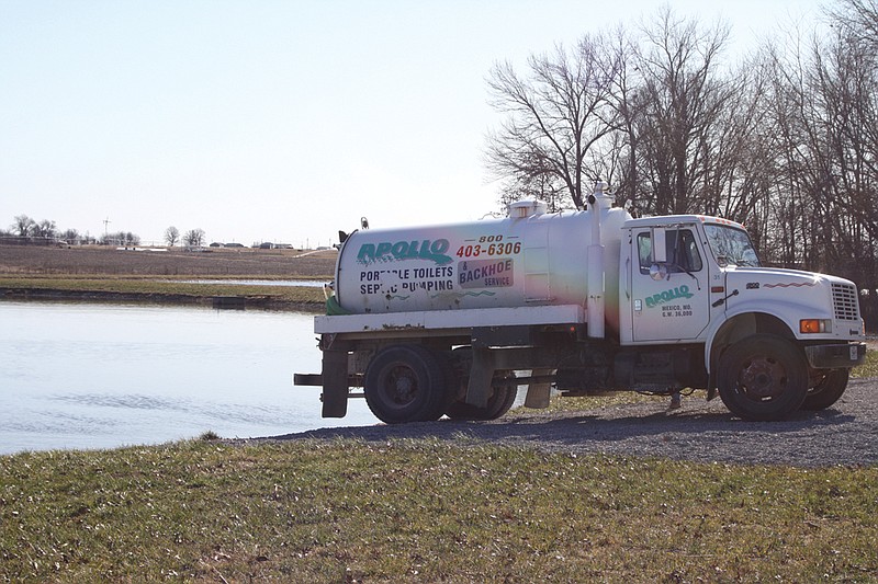 Apollo Septic Pumping and Backhoe Service prepares to dump sewage into one of Auxvasse's storage ponds at its lagoon east of Highway 54 Monday. The lagoon is one of many places the city plans to improve during a major overhaul to its water and sewer system.