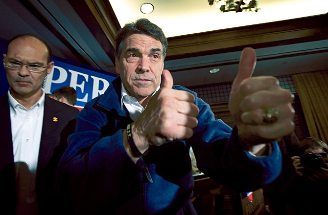 Republican presidential candidate Texas Gov. Rick Perry reacts Monday after speaking to local residents during a campaign stop at the Hotel Pattee in Perry, Iowa. 