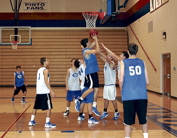 While running a play at practice Thursday morning, Pinto Taron Morris puts up a shot. Morris was the leading scorer against Moberly with 16 points, including a last-second 3-pointer that secured the win for California, 43-40.