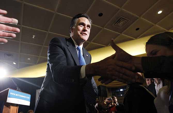 Republican presidential candidate, former Massachusetts Gov. Mitt Romney, greets supporters at his caucus night rally in Des Moines, Iowa, Tuesday, Jan. 3, 2012. 