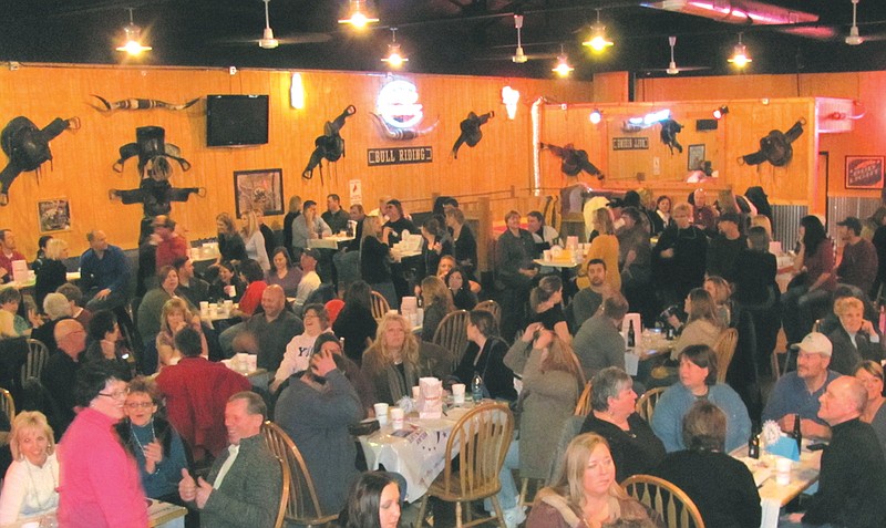 Teams answer questions at last year's Boyd and Boyd, Inc. and Friends Relay For Life Trivia Night held at the Saddle Saloon. This year the event will begin at 7 p.m. at KC Country.