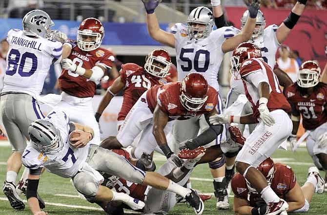 Kansas State quarterback Collin Klein (7) dives into the end zone for second half touchdown during the Cotton Bowl NCAA college football game against Kansas State, Friday Jan. 6, 2012 in Arlington, Texas. Arkansas won 29-16. 