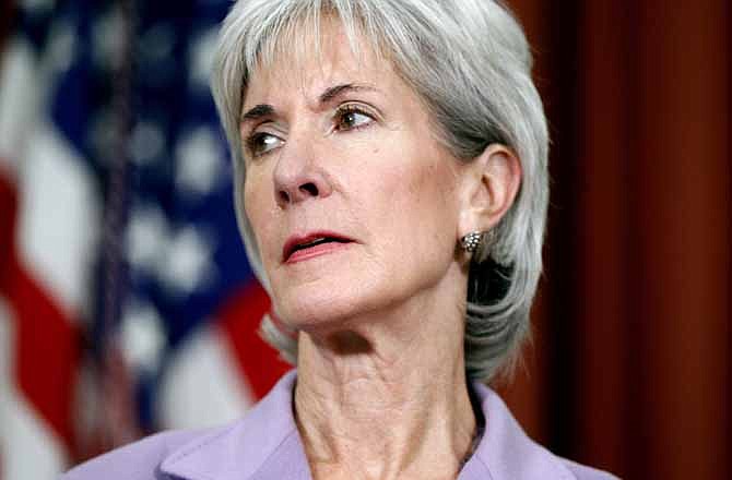 In this Oct. 31, 2011 file photo, Health and Human Services Secretary Kathleen Sebelius is seen in the Oval Office at the White House in Washington. The Obama administration is defending the provisions of its health care overhaul before the U.S. Supreme Court.