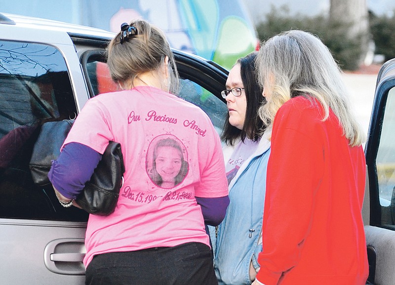 Supporters of 9-year-old homicide victim Elizabeth Olten prepare to drive away from the Cole County Courthouse a few minutes after Alyssa Bustamante entered a guilty plea to second-degree murder Tuesday morning, Jan. 10, 2012, in Jefferson City, Mo. In October 2009, the child was found murdered near her St. Martins home. Bustamante, then 15, was arrested and charged in death a short time later. Bustamante's sentencing hearing is scheduled to begin Feb. 6, 2012. 