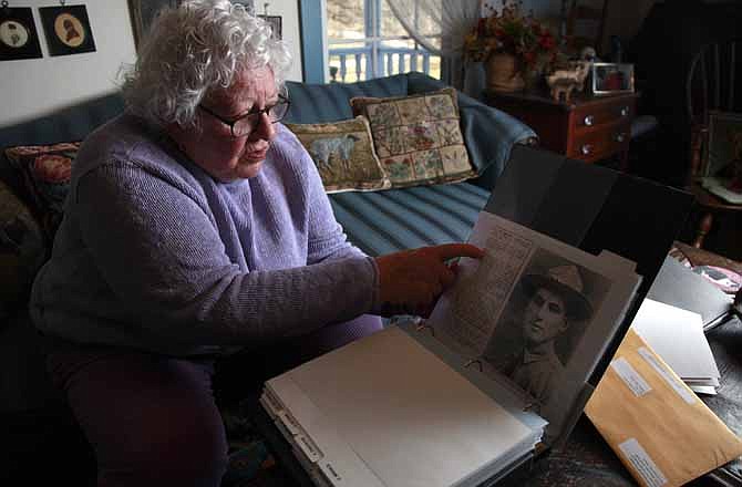 Elsie Shemin-Roth flips through a book documenting the heroic acts of her father, William Shemin, during World War I, Thursday, Jan. 5, 2012, at her home in Labadie, Mo. Thanks to the tireless effort of his daughter and nearly four decades after his death, Shemin may finally be awarded the Medal of Honor for his actions, but never received, many believe because he was Jewish.