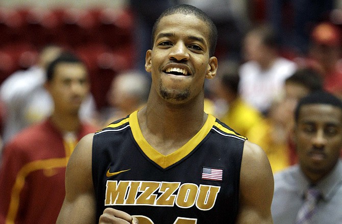 Missouri guard Kim English smiles as he runs off the court following the Tigers' 76-69 win at Iowa State on Wednesday.