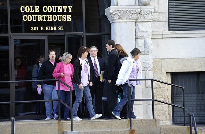 Elizabeth Olten's mother, Patty Preiss, in dark wind breaker center, leaves the Cole County Courthouse with supporters after Alyssa Bustamante entered a guilty plea to second-degree murder Tuesday morning. In October 2009, 9-year-old Elizabeth was found murdered near her St. Martins home. 