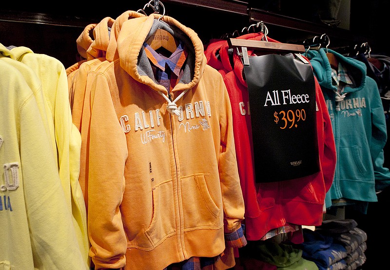 Hooded fleece jackets are on sale Thursday at Who.A.U in New York. Unusually mild temperatures across a broad swath of the country has left stores with mounds of winter merchandise. 