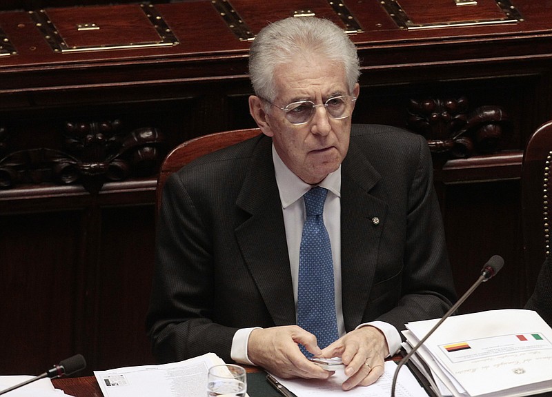 Italian Premier Mario Monti attends a debate Thursday at the lower chamber in Rome. Monti says he would support a new tax on financial transactions so long as it applies to the European Union as a whole.