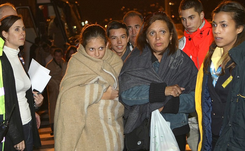 Survivors of the luxury cruise ship Costa Concordia, which ran aground near the tiny Tuscan island of Giglio, Italy, arrive at the harbor in Marseille, southern France, Saturday.