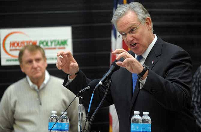 Missouri Gov. Jay Nixon gestures during a news conference to announce the "Missouri Works" initiative at Houston Polytank in Hopkins, Mo. Monday afternoon Jan. 9, 2012. Jobs are likely to be a key part of Nixon's State of the State address Jan. 17, as well as a central theme of the 2012 campaign for everything from the presidency and governorship down to state legislative races.