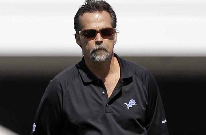 In this Aug. 10, 2011, file photo, former Tennessee Titans head coach Jeff Fisher watch the Detroit Lions practice at NFL football training camp in Allen Park, Mich. Fisher is the new coach of the St. Louis Rams.