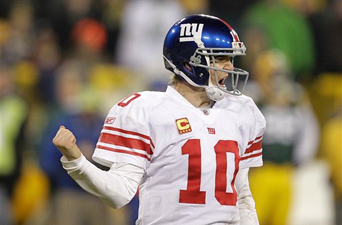 Giants quarterback Eli Manning reacts during the second half of their playoff game against the Packers Sunday in Green Bay. The Giants won 37-20 to advance to the NFC title game.