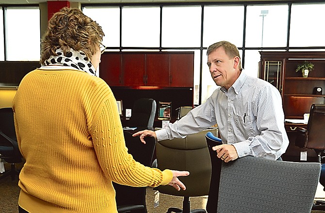 Dan Eiken of Samco, an office and business supply store in Jefferson City, talks with a customer. Eiken is a proponent of a sales tax on Internet sales.