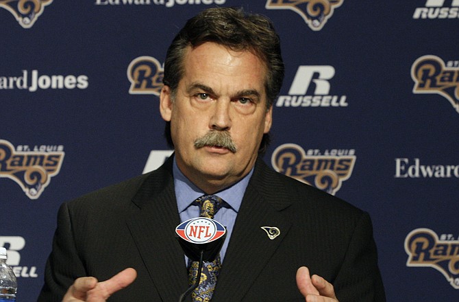 Jeff Fisher speaks during a news conference Tuesday in St. Louis where he was officially introduced as the new head football coach of the Rams.