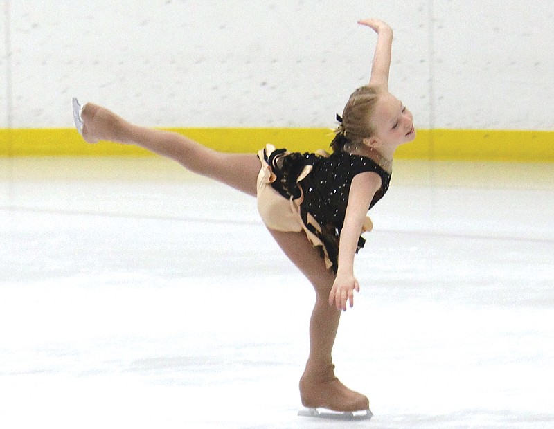 Haley Huffman (left) competes at an event held at Washington Park Ice Arena.