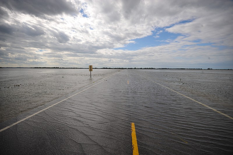 Flood waters cover highway 159 in June 2011, in Big Lake, Mo. Utah and Missouri stand to receive more than one-third of $308 million in federal disaster aid announced Wednesday by Agriculture Secretary Tom Vilsack.