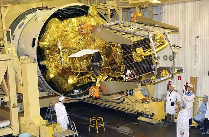 In this Nov. 2, 2011 file photo distributed by Russian Roscosmos space agency technicians work on the Phobos-Ground probe at Baikonur, Kazakhstan. Some of the recent failures of Russian spacecraft may have been caused by hostile interference, Roscosmos chief Vladimir Popovkin said.