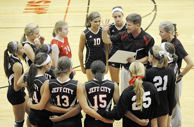 Jefferson City volleyball, Curt Yaeger tells the team what he wants them to do when they go back on the floor.