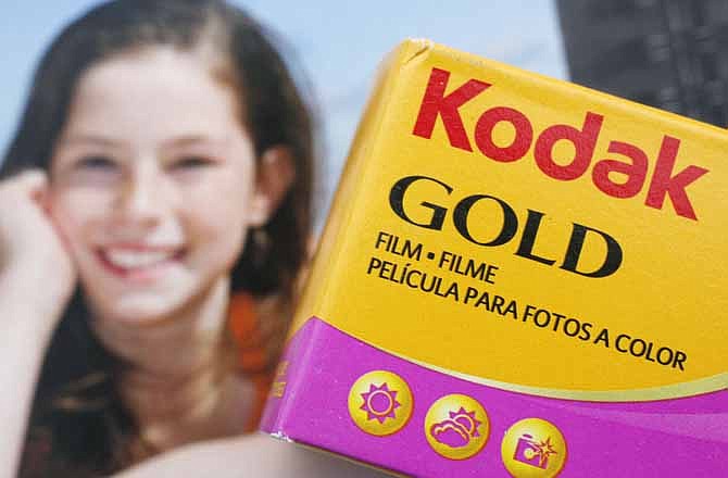 A box of Kodak Gold 200 35mm color film is shown against a box of Kodak inkjet paper for an illustration, Thursday, Jan. 5, 2012 in New York.