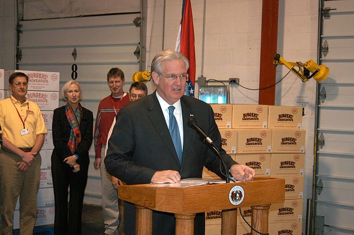 Gov. Jay Nixon speaks about Missouri Works, his comprehensive job creation strategy at Burgers' Smokehouse on Friday, Jan. 20. Behind the governor are several Burgers' officials and Missouri First Lady Georganne Nixon.