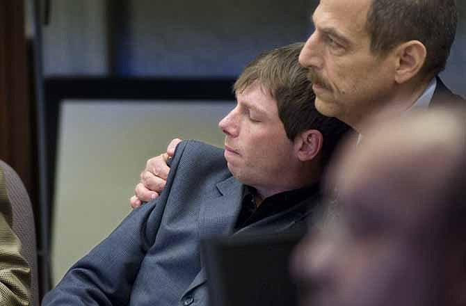 In this Tuesday, April 13, 2010 file photo, Kerry Lewis, left, leans into his lawyer Paul Mones after the verdict against the Boy Scouts of America was announced in Portland, Ore. The jury decided that the Boy Scouts were negligent for allowing the abuser to associate with Lewis and other boys after admitting to a Scouts official in 1983 that he had molested 17 boys. Within a few months of that judgment, the Scouts announced that all adult volunteers - now numbering 1.2 million - would be required to take child-protection training when they join the Scouts and repeat the training every two years. 